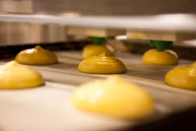 Photo of Cookie Batter Being Dispensed into a Pan